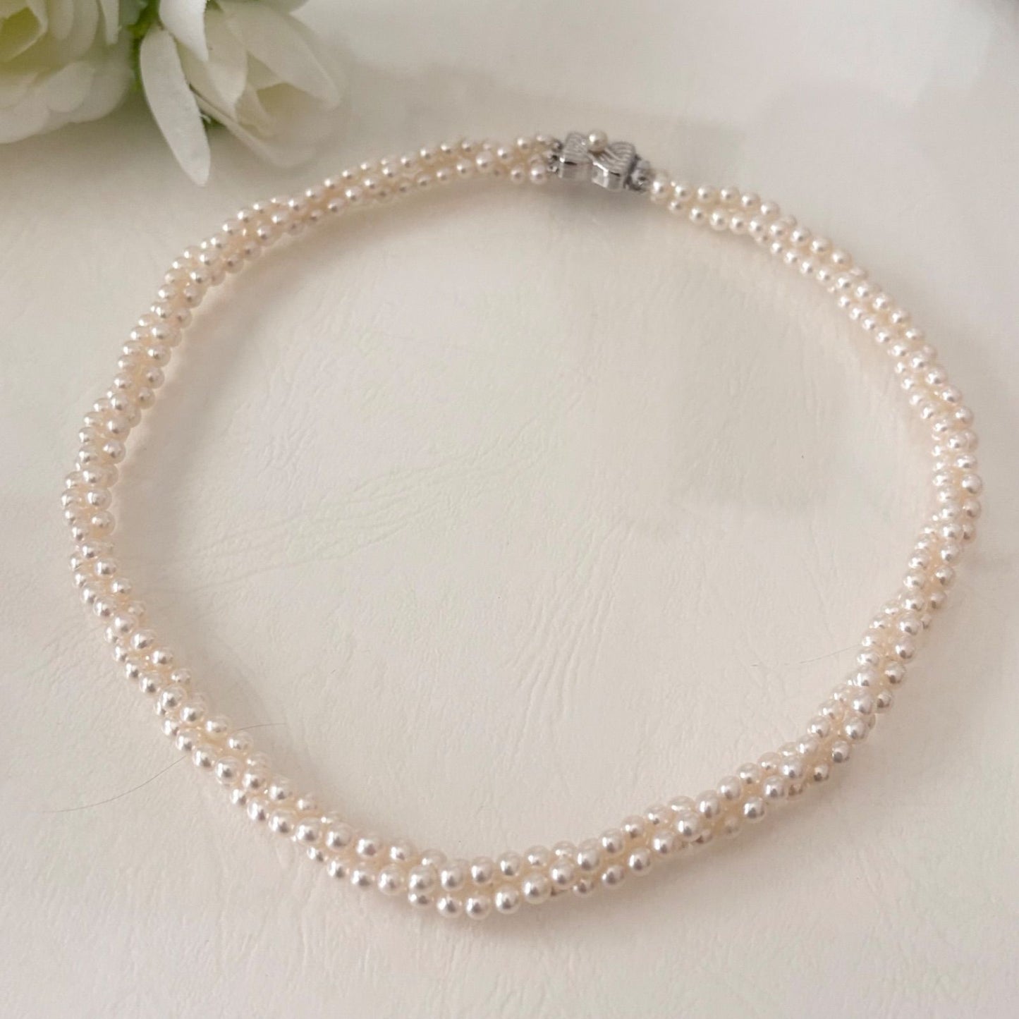 188 Tasaki silver three-row necklace featuring baby pearls and a ribbon clasp, 42.5 cm length