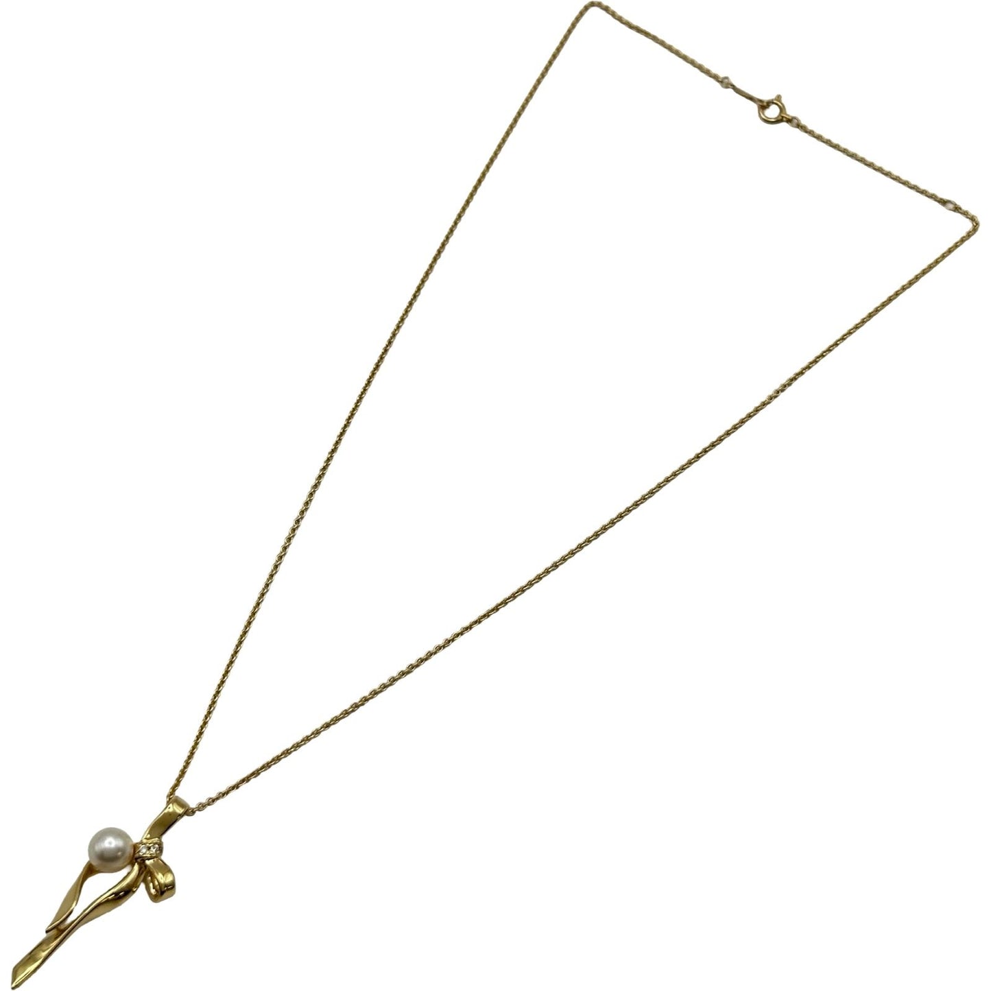 Mikimoto gold K18 ribbon necklace with pearl and diamond details on a white background