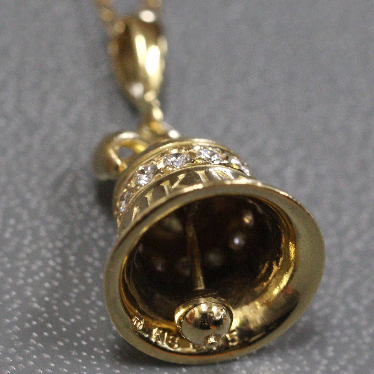 Mikimoto K18 diamond pendant featuring bell motif with 0.15ct diamond on 40cm chain