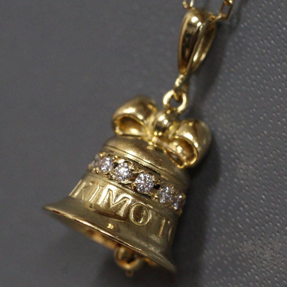 Mikimoto K18 diamond pendant featuring bell motif with 0.15ct diamond on 40cm chain