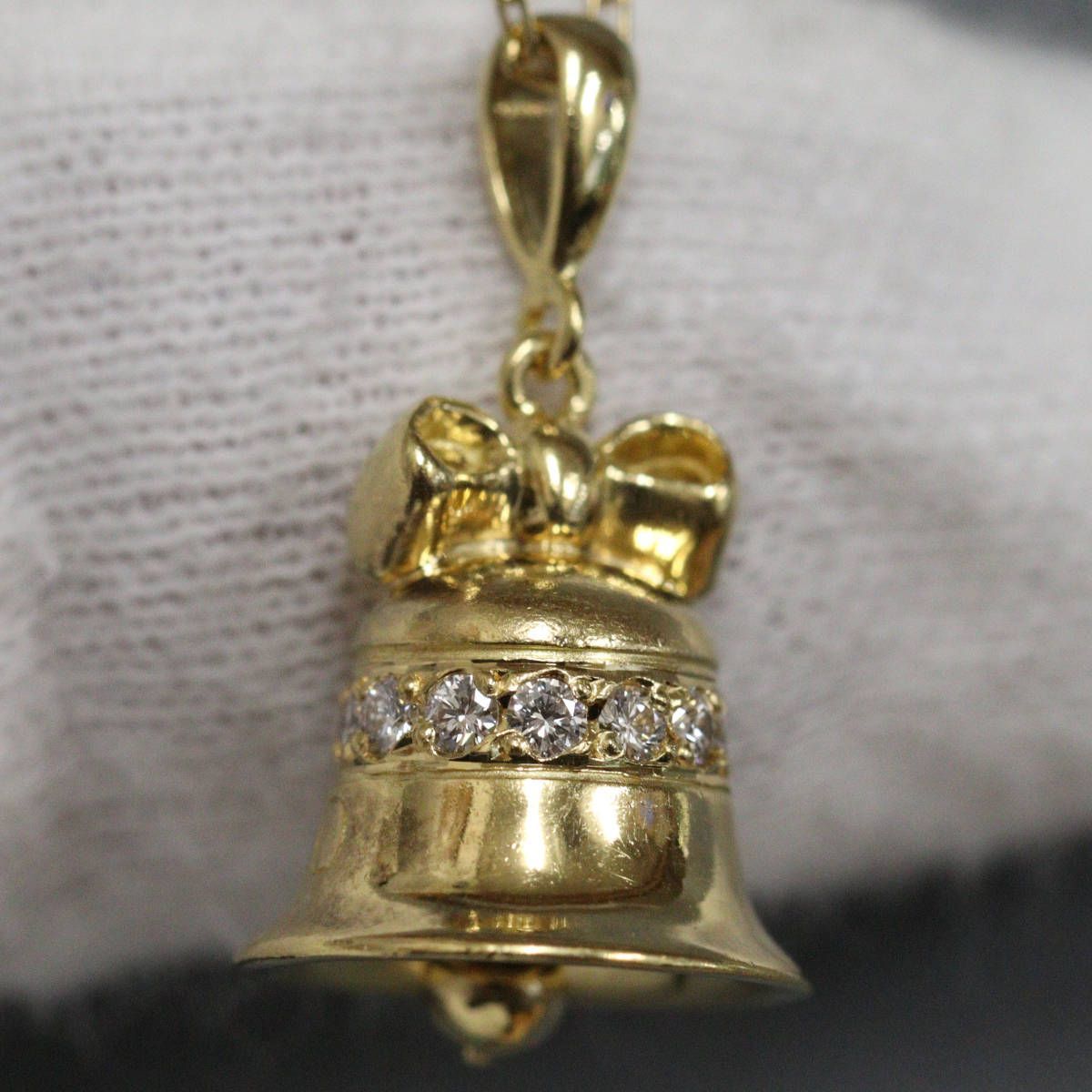 Mikimoto K18 diamond pendant featuring bell motif with 0.15ct diamond on 40cm chain