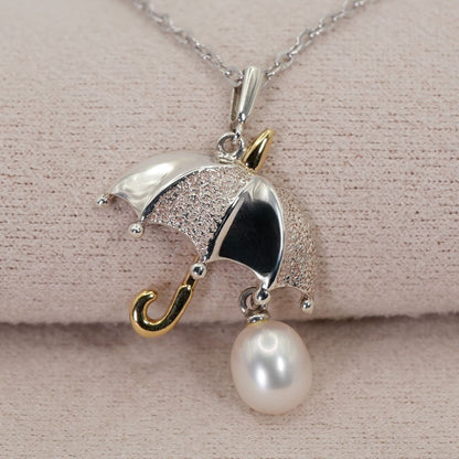 Mikimoto Umbrella Necklace made of silver, K18 gold, and pearl shown on a white background