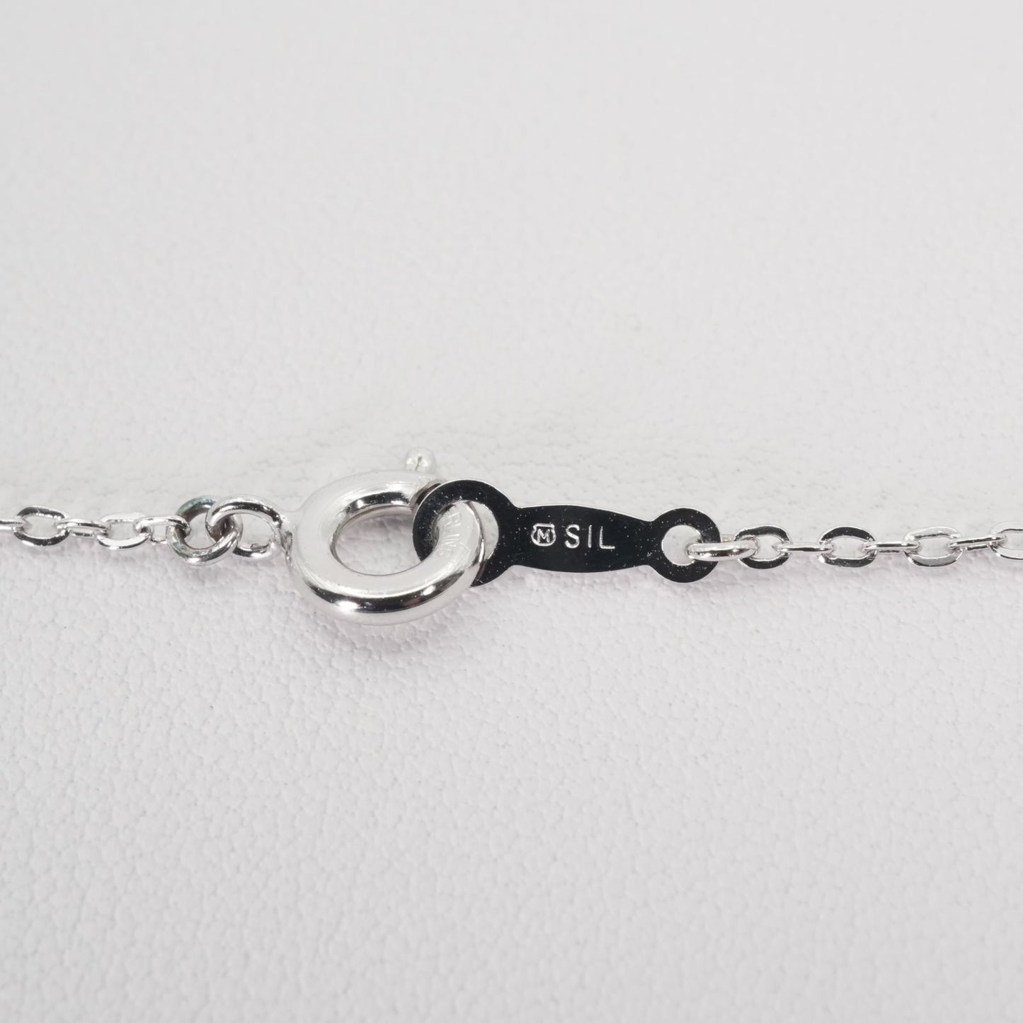 Mikimoto Umbrella Necklace made of silver, K18 gold, and pearl shown on a white background