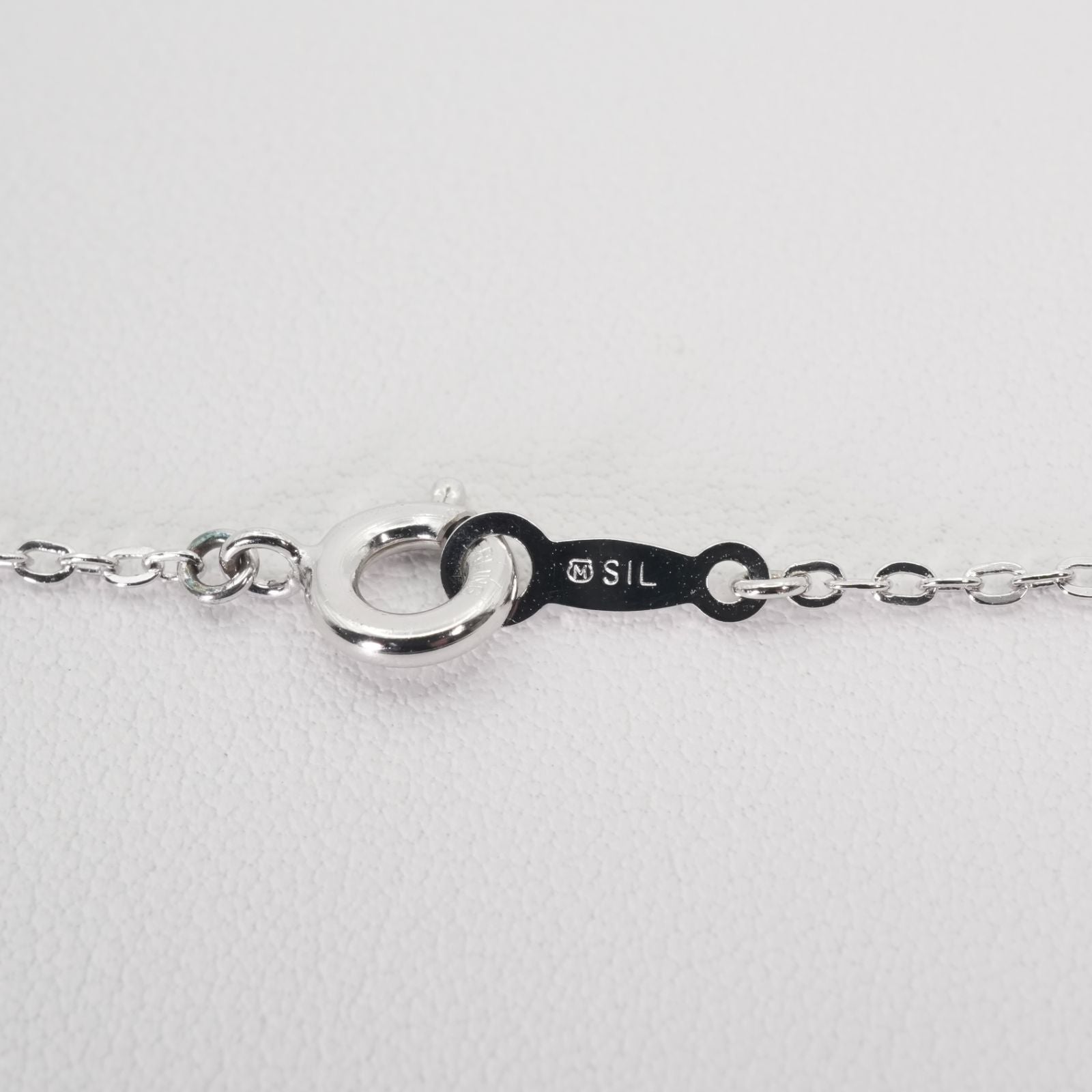 Mikimoto Umbrella Necklace made of silver, K18 gold, and pearl shown on a white background