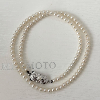 469 Mikimoto silver necklace featuring baby pearls with a 40cm length and silver clasp with minor scratches