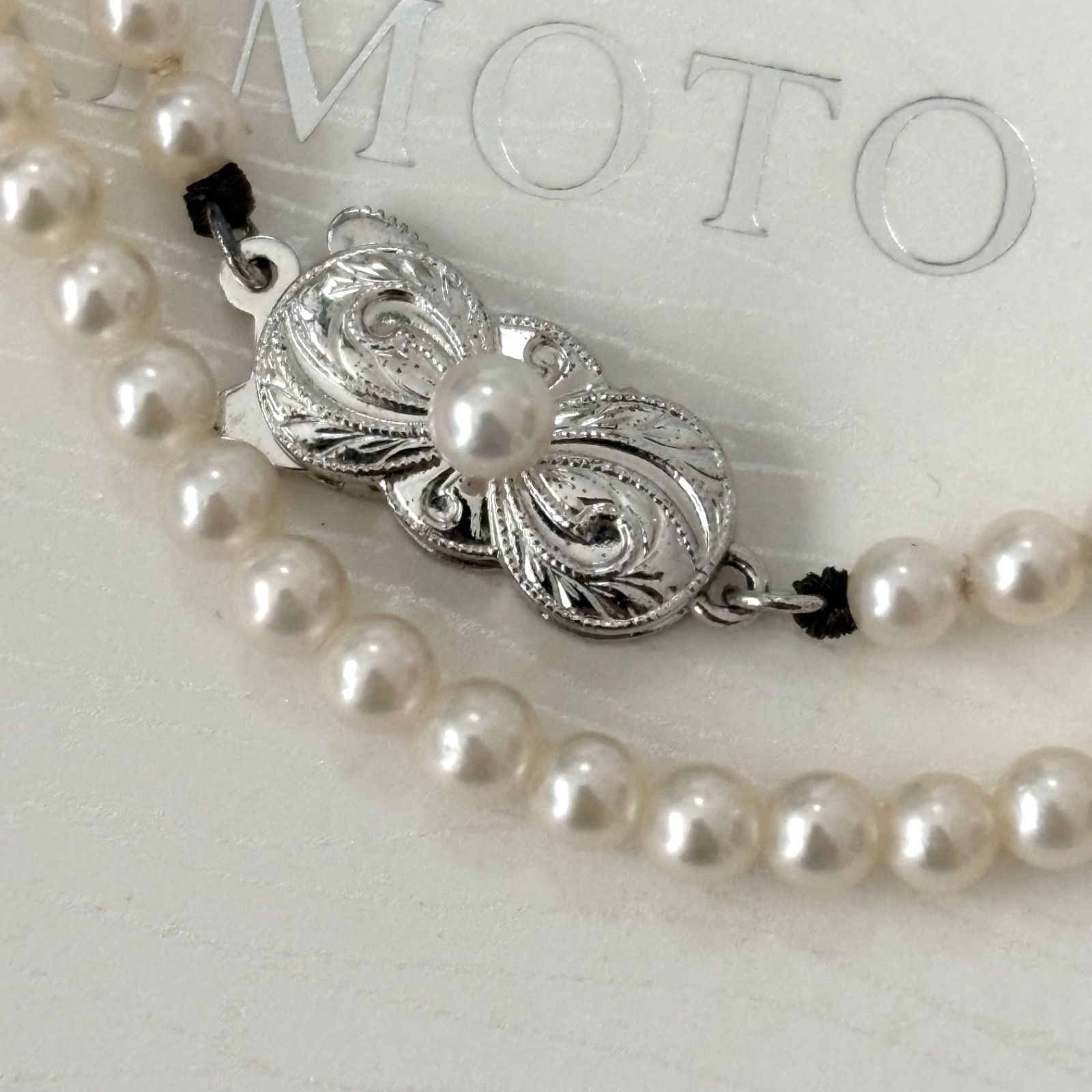 469 Mikimoto silver necklace featuring baby pearls with a 40cm length and silver clasp with minor scratches