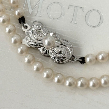 469 Mikimoto silver necklace featuring baby pearls with a 40cm length and silver clasp with minor scratches