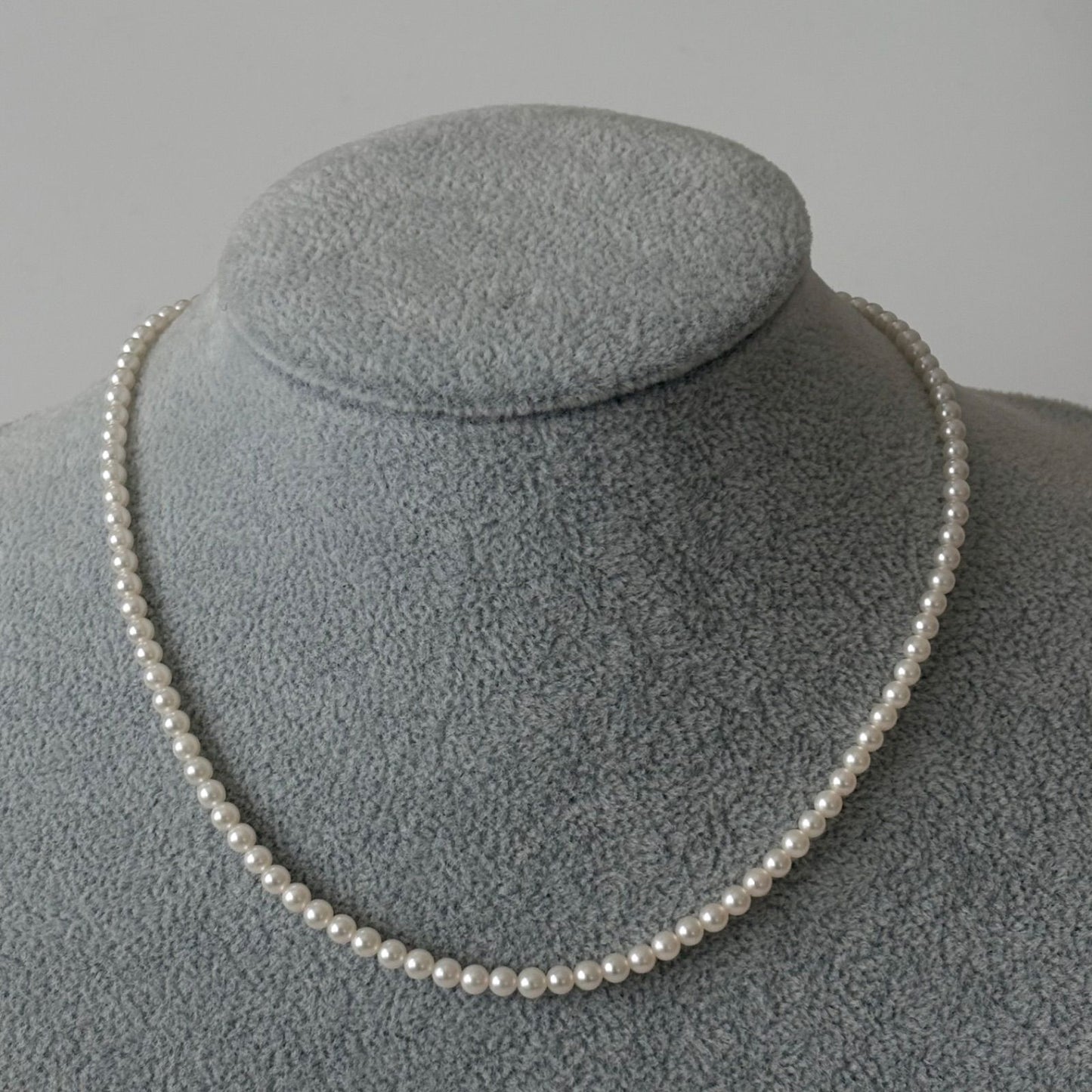 469 Mikimoto silver necklace featuring baby pearls with a 40cm length and silver clasp with minor scratches