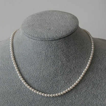 469 Mikimoto silver necklace featuring baby pearls with a 40cm length and silver clasp with minor scratches