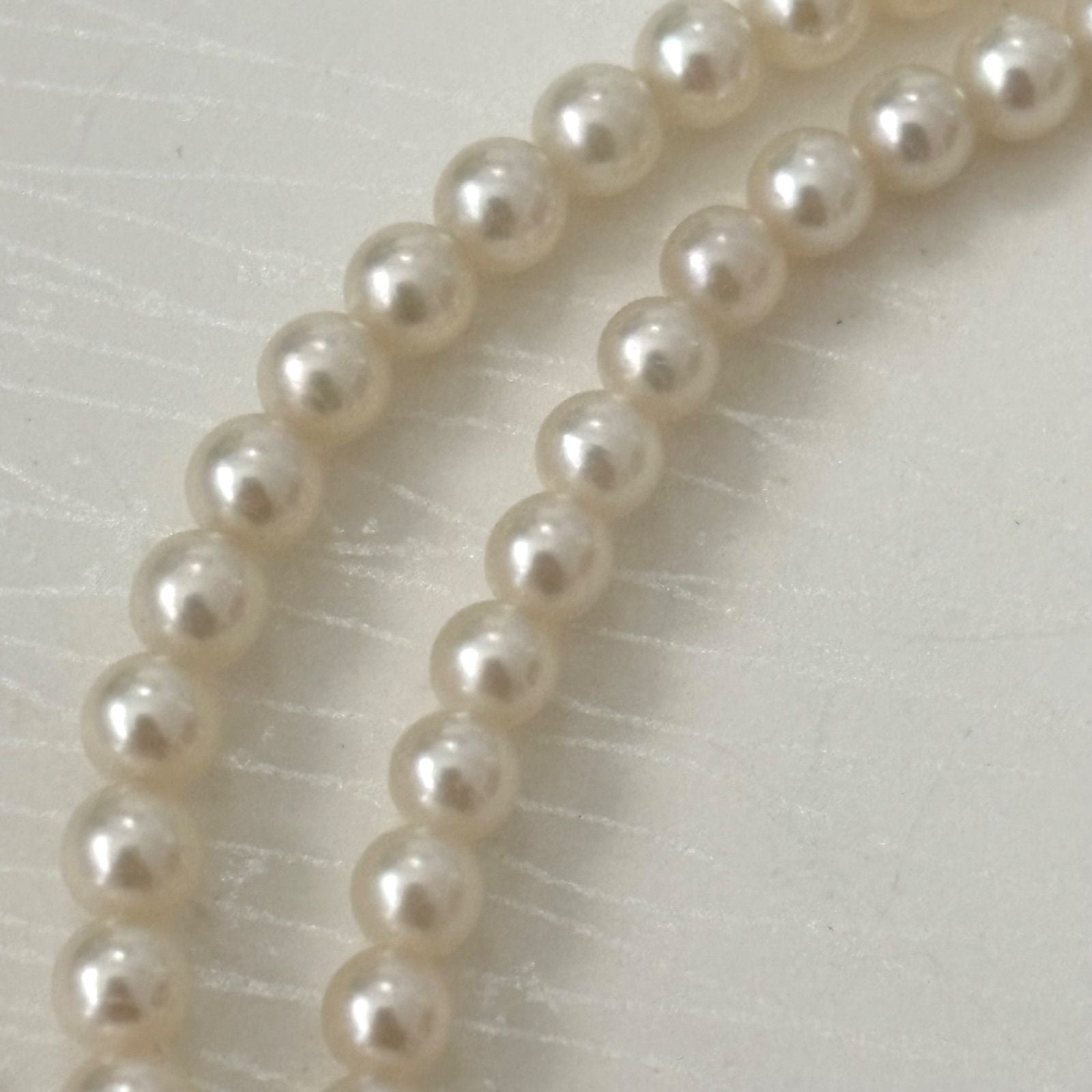 469 Mikimoto silver necklace featuring baby pearls with a 40cm length and silver clasp with minor scratches