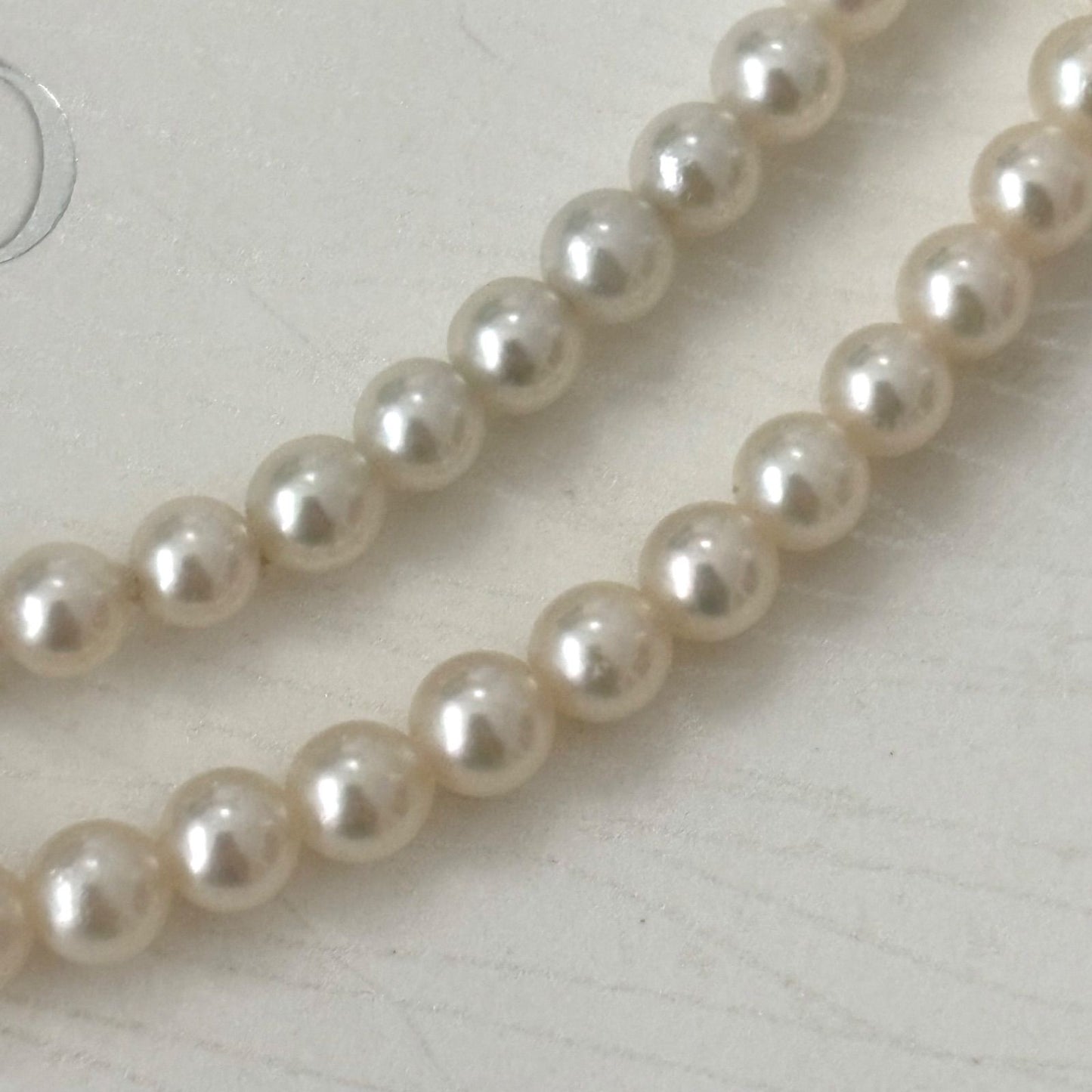 469 Mikimoto silver necklace featuring baby pearls with a 40cm length and silver clasp with minor scratches