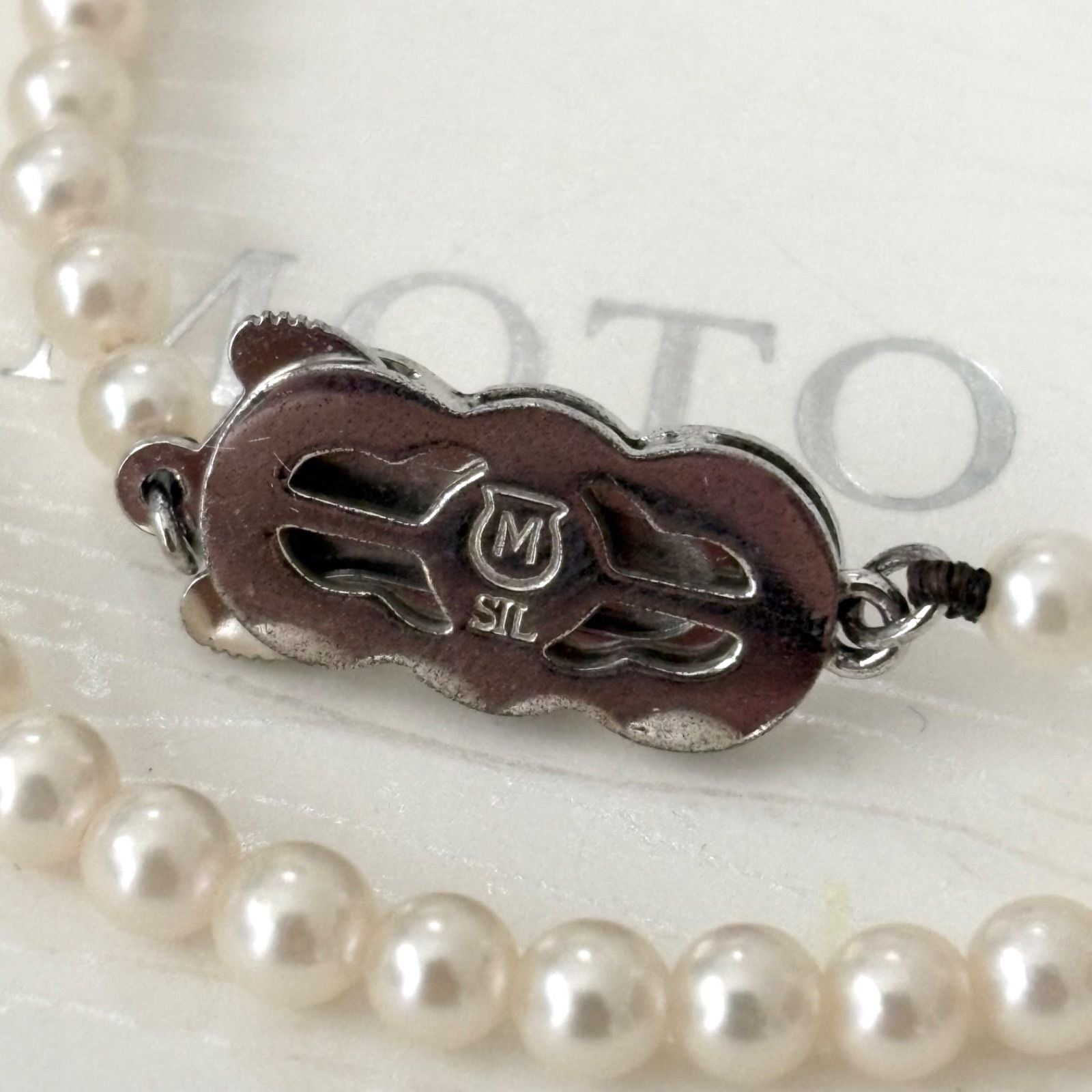 469 Mikimoto silver necklace featuring baby pearls with a 40cm length and silver clasp with minor scratches