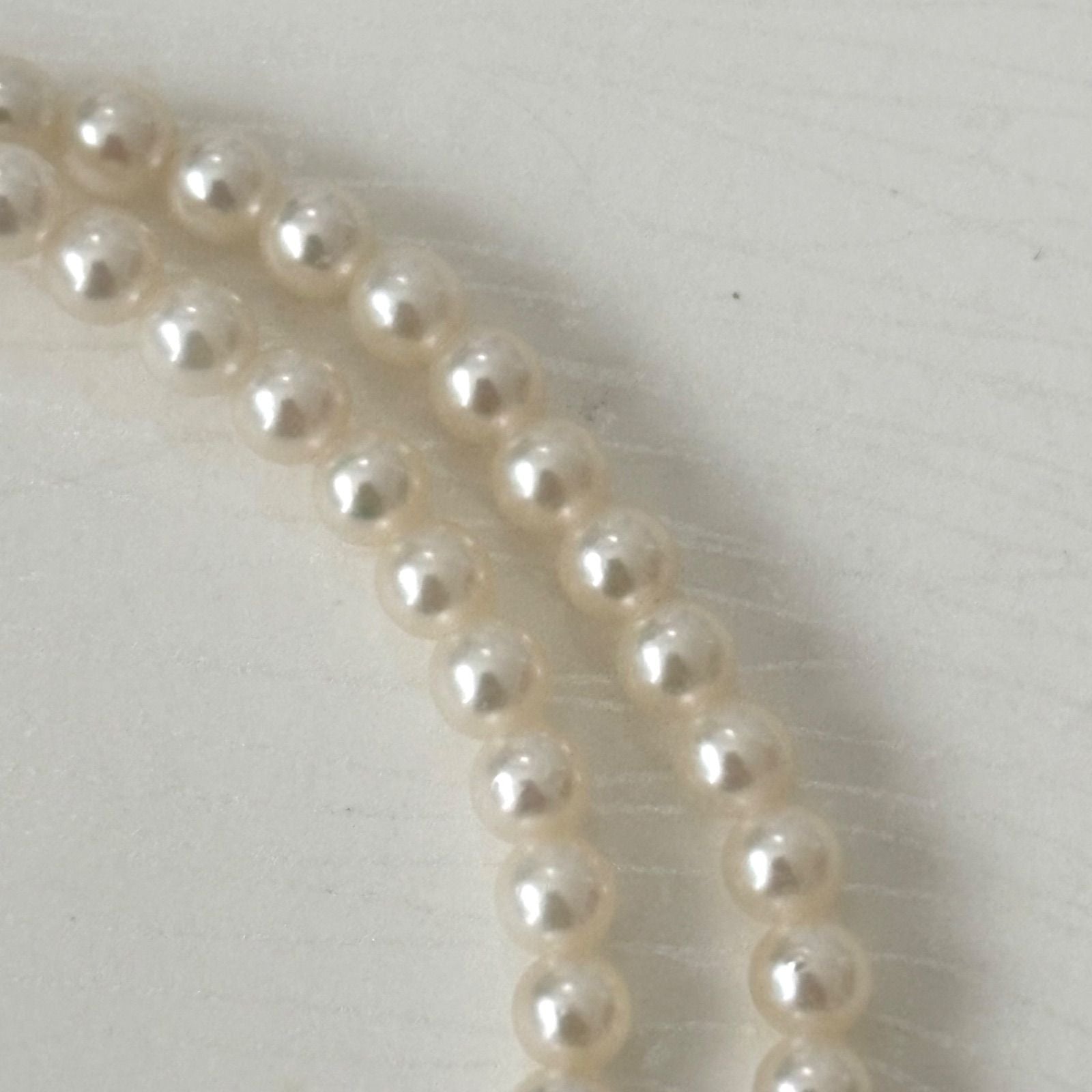 469 Mikimoto silver necklace featuring baby pearls with a 40cm length and silver clasp with minor scratches