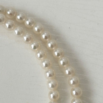 469 Mikimoto silver necklace featuring baby pearls with a 40cm length and silver clasp with minor scratches