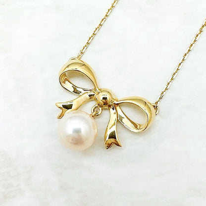 MIKIMOTO 7.2mm pearl necklace with yellow gold ribbon pendant, approximately 40cm length