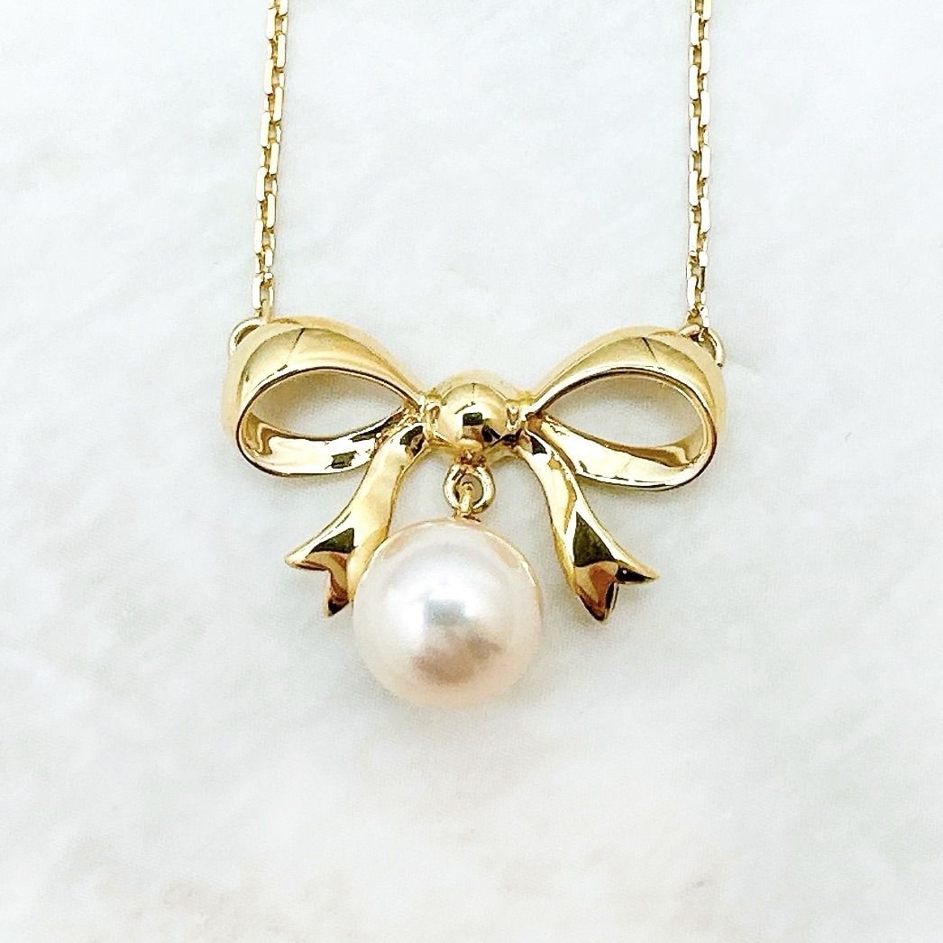 MIKIMOTO 7.2mm pearl necklace with yellow gold ribbon pendant, approximately 40cm length