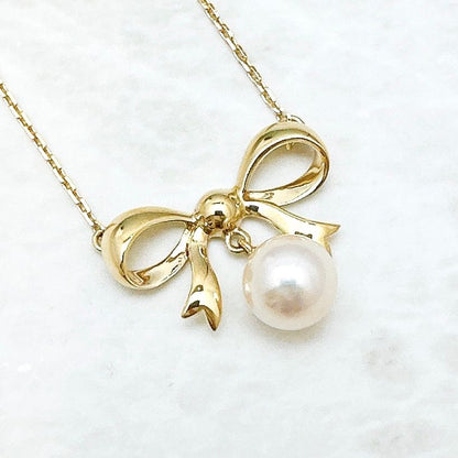 MIKIMOTO 7.2mm pearl necklace with yellow gold ribbon pendant, approximately 40cm length