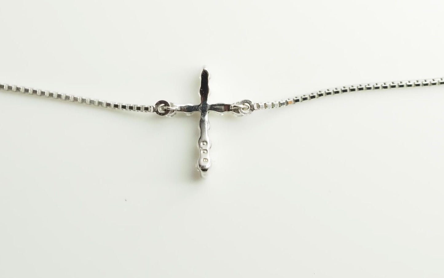 Agete Law K10WG diamond cross necklace in 10 karat white gold with pouch