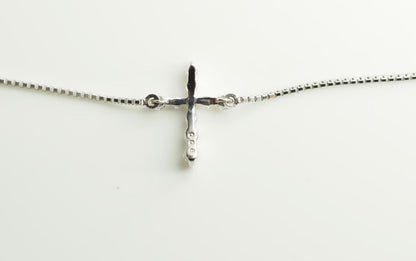 Agete Law K10WG diamond cross necklace in 10 karat white gold with pouch