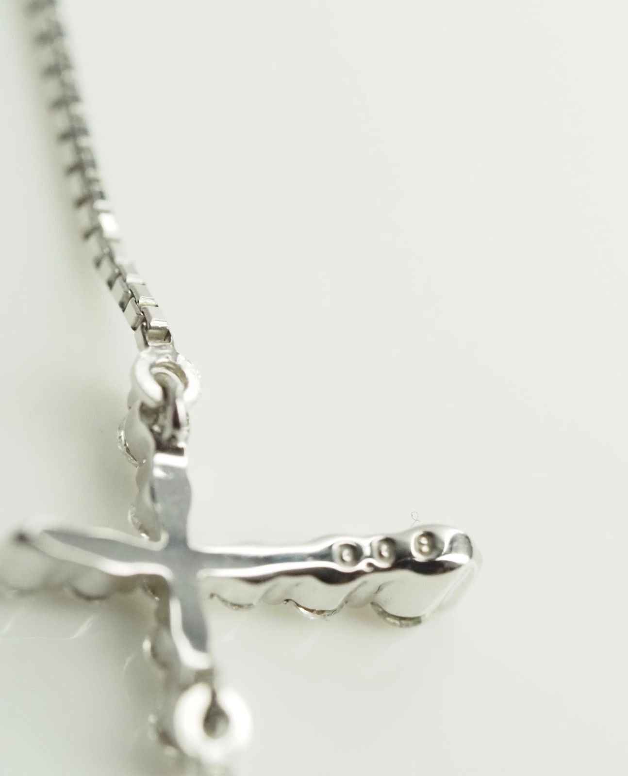Agete Law K10WG diamond cross necklace in 10 karat white gold with pouch