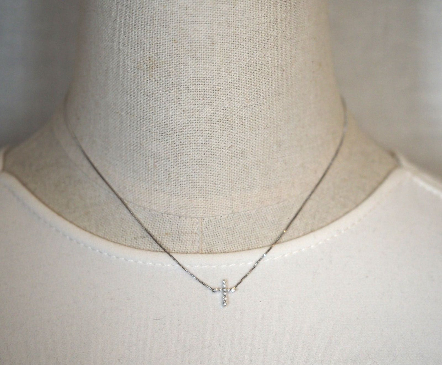 Agete Law K10WG diamond cross necklace in 10 karat white gold with pouch