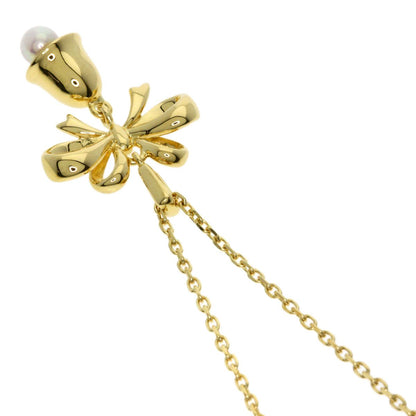 Mikimoto ladies pearl necklace with bell ribbon motif in yellow gold, 3.4mm pearls on 38cm chain