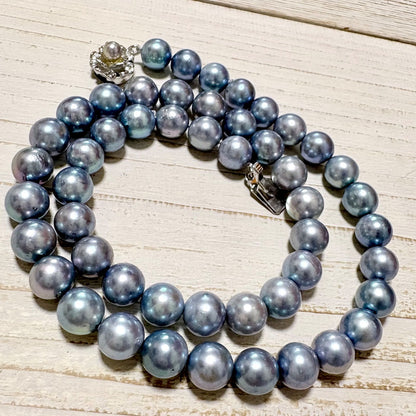 Honmei pearl necklace featuring 8mm blue gray pearls and silver engraved clasp on a white background