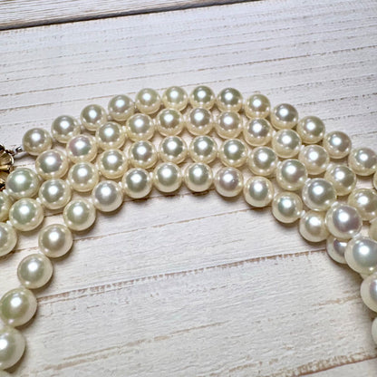 K14 Akoya pearl necklace with 7mm pearls, 127cm long, displayed on a white background