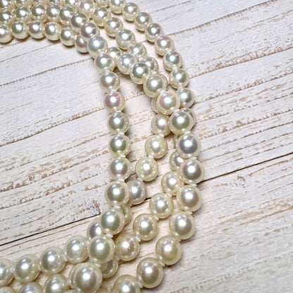 K14 Akoya pearl necklace with 7mm pearls, 127cm long, displayed on a white background