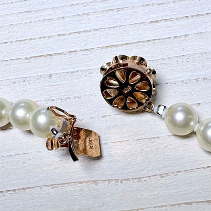 K14 Akoya pearl necklace with 7mm pearls, 127cm long, displayed on a white background