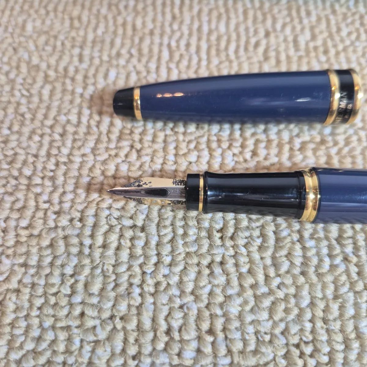 Waterman Expert fountain pen in blue with gold trim and fine nib, displayed with original stained box