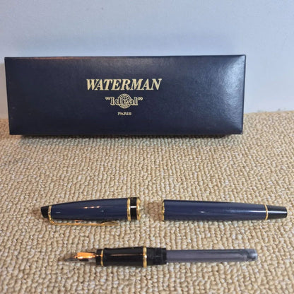 Waterman Expert fountain pen in blue with gold trim and fine nib, displayed with original stained box