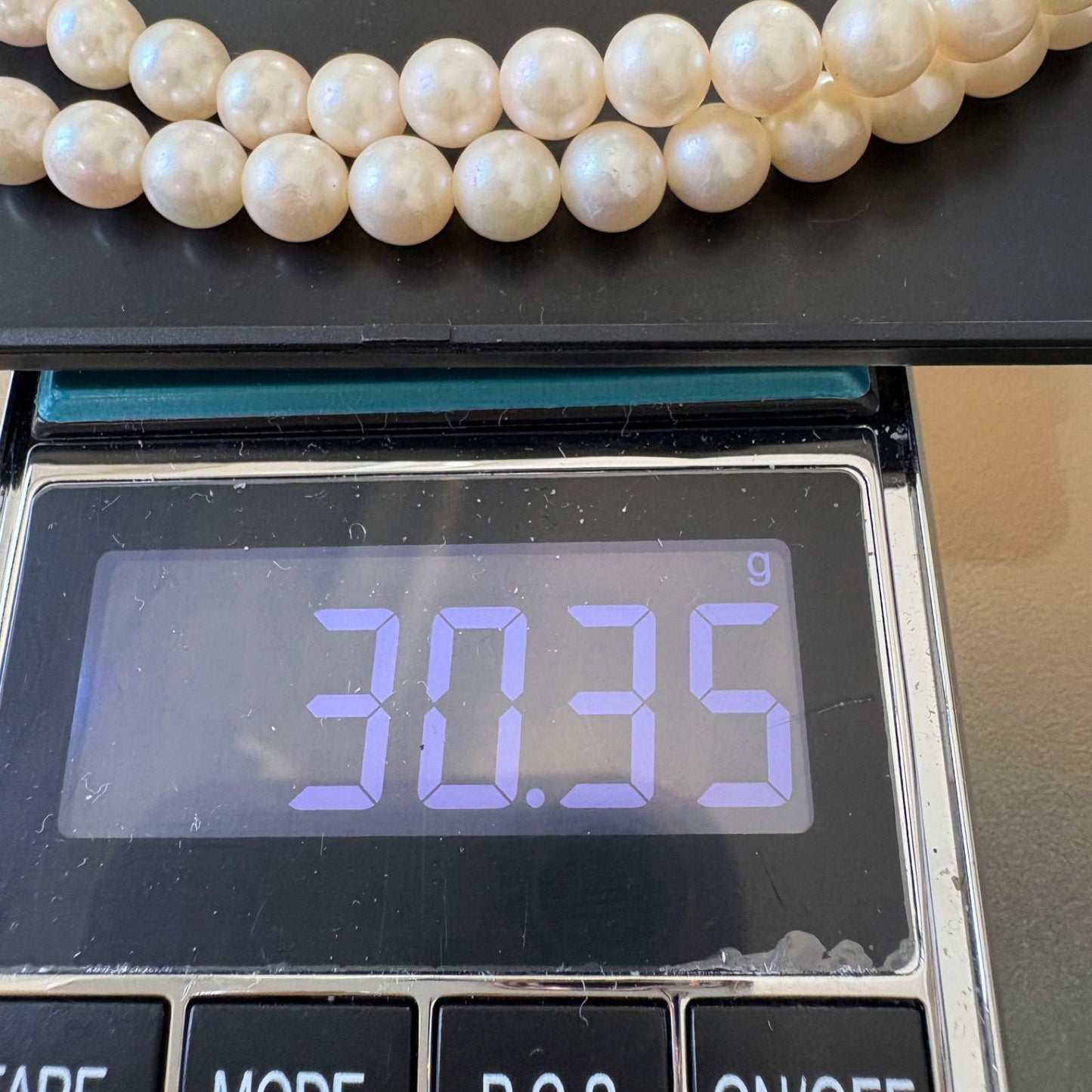 TASAKI Akoya pearl necklace featuring 6.5-7.0mm pearls and silver clasp on a 43cm strand