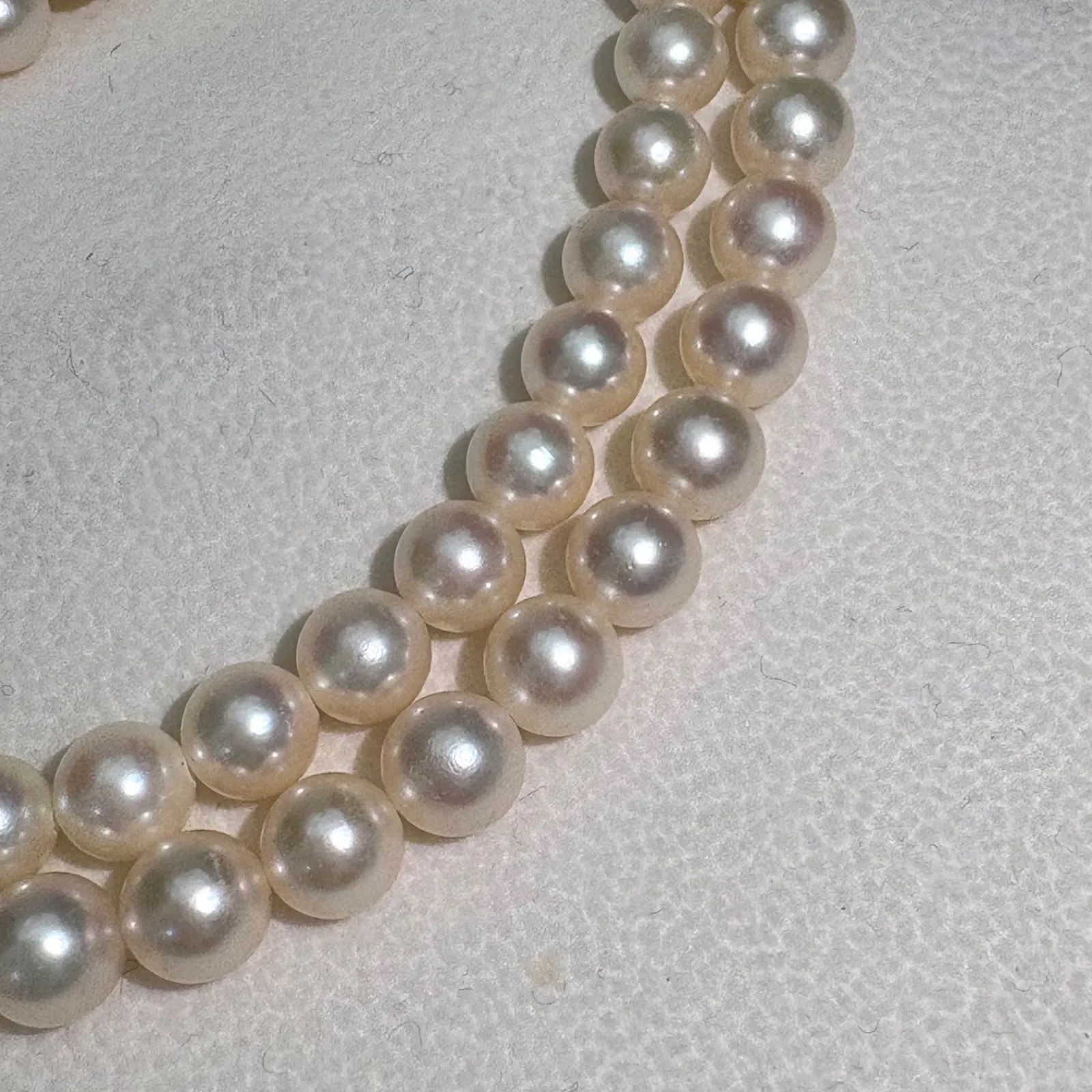 TASAKI Akoya pearl necklace featuring 6.5-7.0mm pearls and silver clasp on a 43cm strand