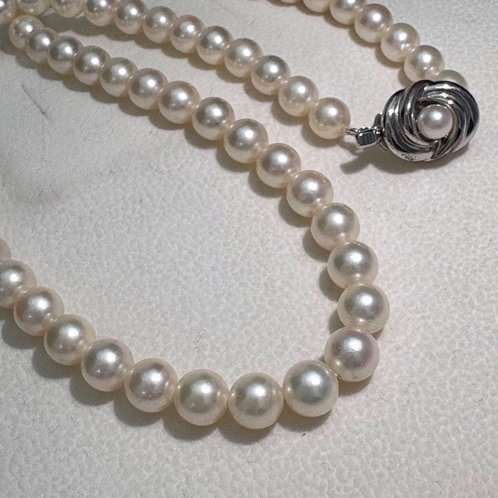 TASAKI Akoya pearl necklace featuring 6.5-7.0mm pearls and silver clasp on a 43cm strand
