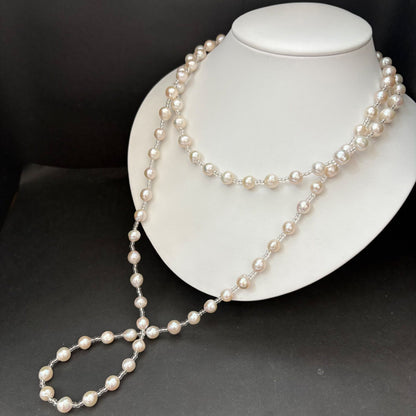 Long necklace featuring lustrous baroque Akoya pearls and crystal beads measuring about 120cm