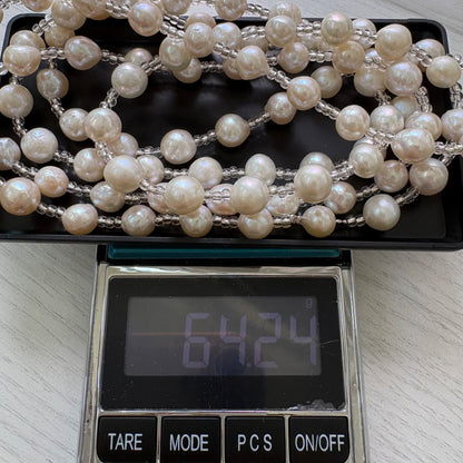Long necklace featuring lustrous baroque Akoya pearls and crystal beads measuring about 120cm