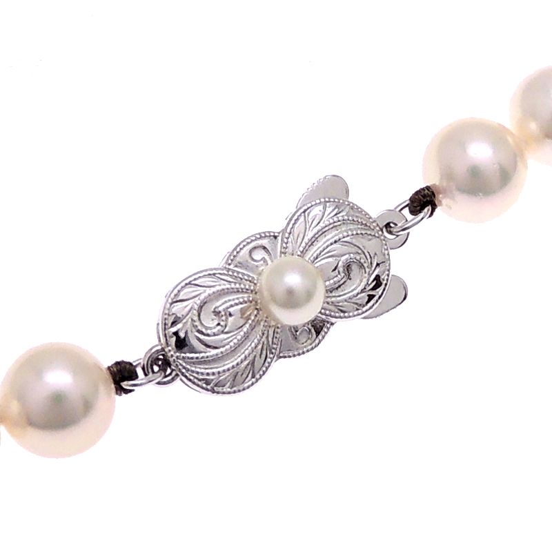 Mikimoto pearl necklace with 7 to 7.5 mm pearls and 43 cm length displayed on a white background