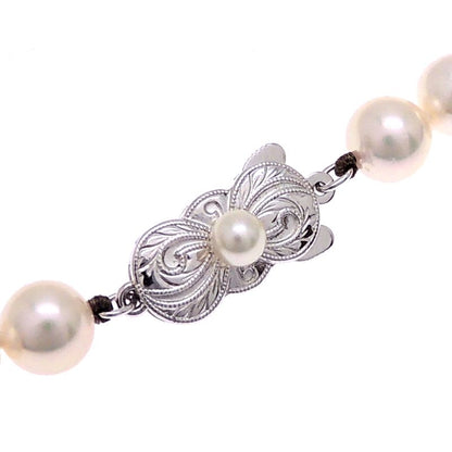 Mikimoto pearl necklace with 7 to 7.5 mm pearls and 43 cm length displayed on a white background