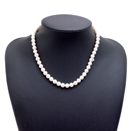 Mikimoto pearl necklace with 7 to 7.5 mm pearls and 43 cm length displayed on a white background