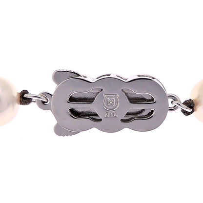 Mikimoto pearl necklace with 7 to 7.5 mm pearls and 43 cm length displayed on a white background