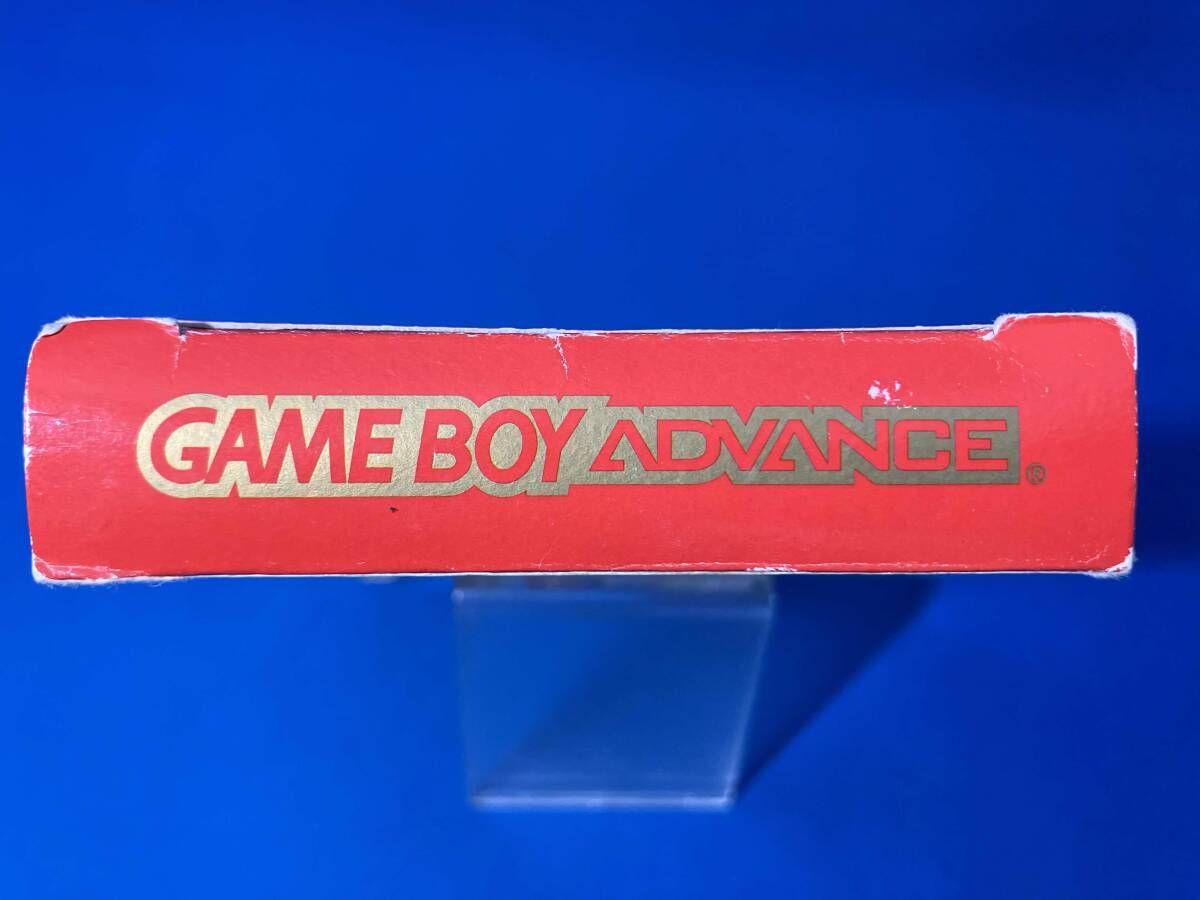 MOTHER1+2 game cartridge with damaged box and manual showing visible scratches and wear
