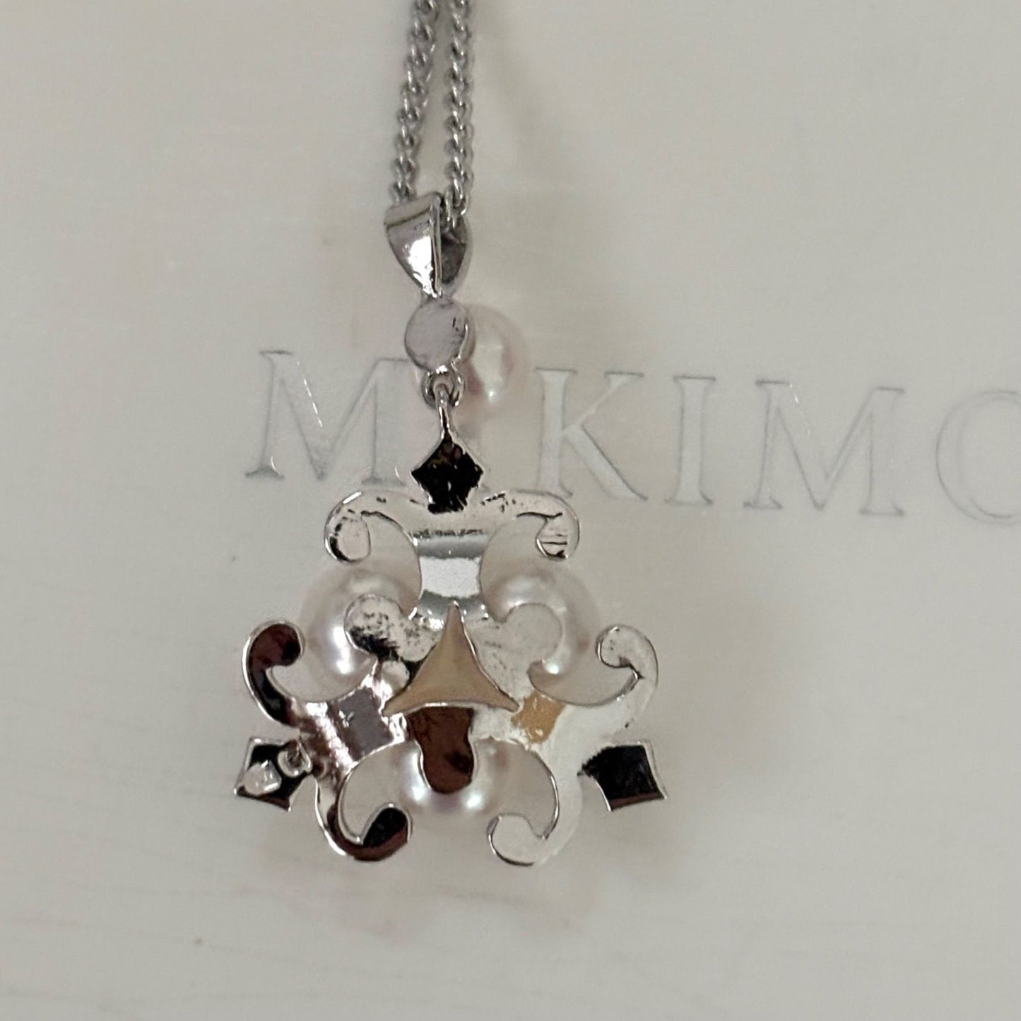 370 Mikimoto silver necklace with round pearls and 42cm length on a white background