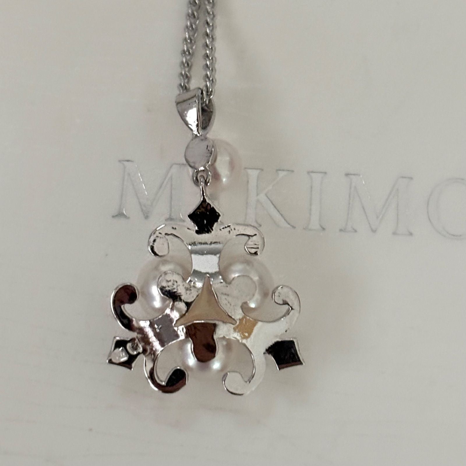 370 Mikimoto silver necklace with round pearls and 42cm length on a white background