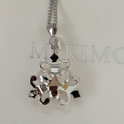 370 Mikimoto silver necklace with round pearls and 42cm length on a white background