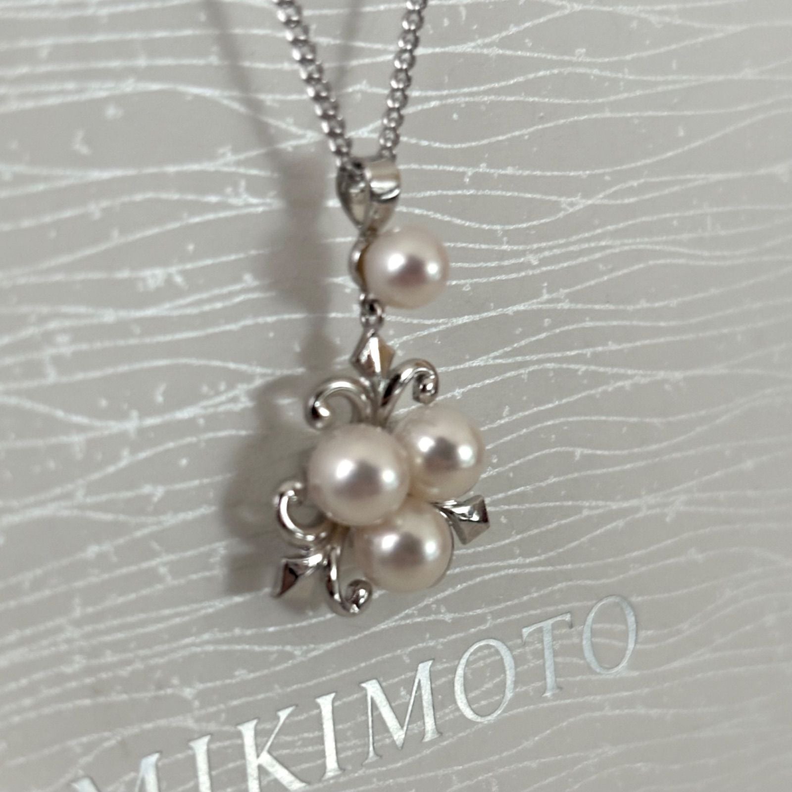 370 Mikimoto silver necklace with round pearls and 42cm length on a white background
