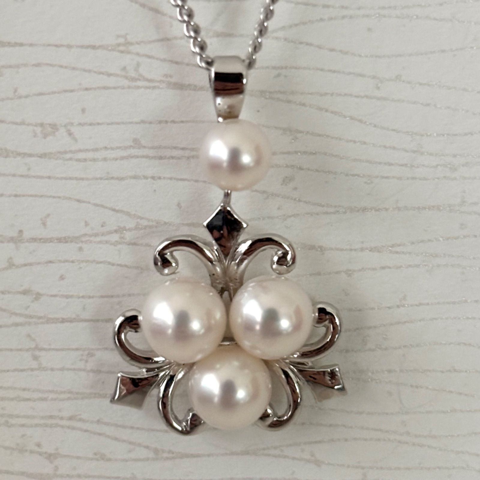 370 Mikimoto silver necklace with round pearls and 42cm length on a white background