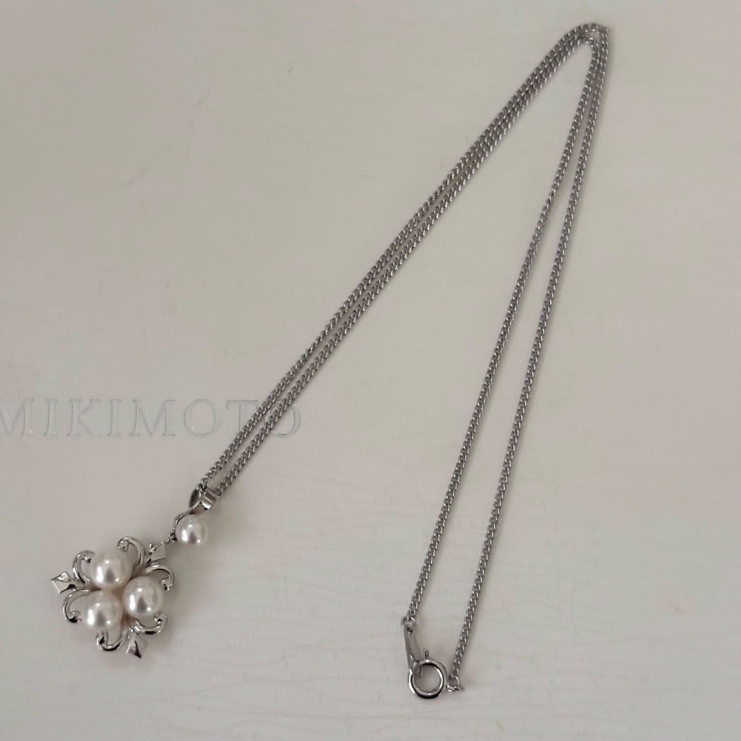 370 Mikimoto silver necklace with round pearls and 42cm length on a white background