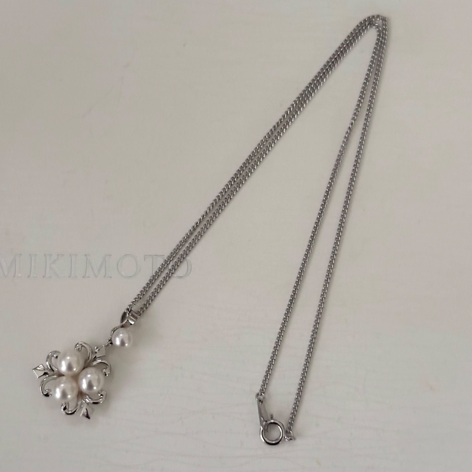 370 Mikimoto silver necklace with round pearls and 42cm length on a white background