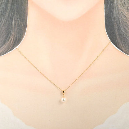 Mikimoto pearl necklace with 7mm pearls on a 40cm K18 yellow gold chain